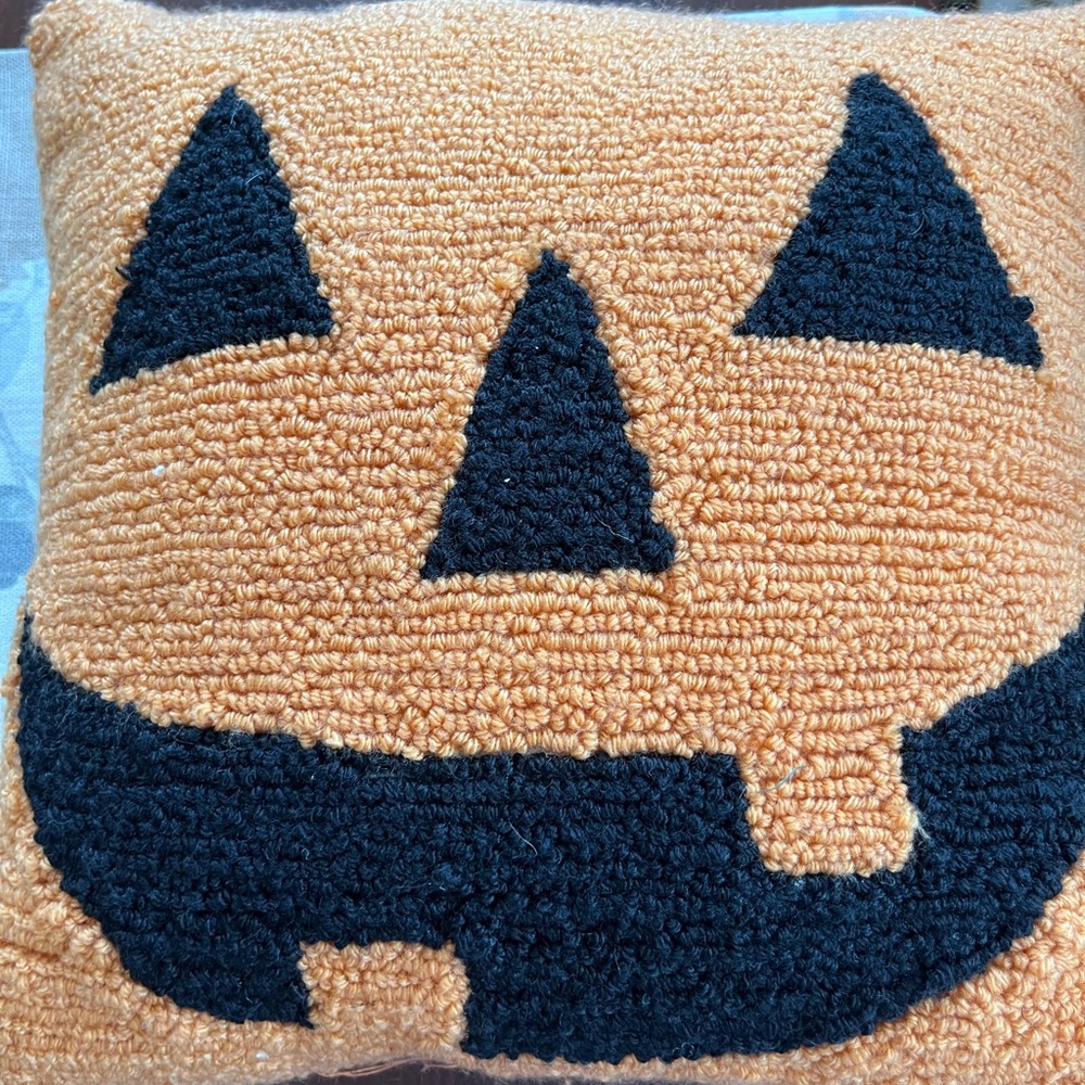 The Midnight Market Orange Knit seasonal pillow. Measures 12” by 12”